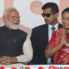 Bharatiya Janata Party leader Rekha Gupta, right, gestures as she talks to Indian Prime Minister Narendra Modi during her swearing in ceremony as Delhi state chief minister in New Delhi, India, Thursday, Feb. 20, 2025. (AP Photo/Manish Swarup)